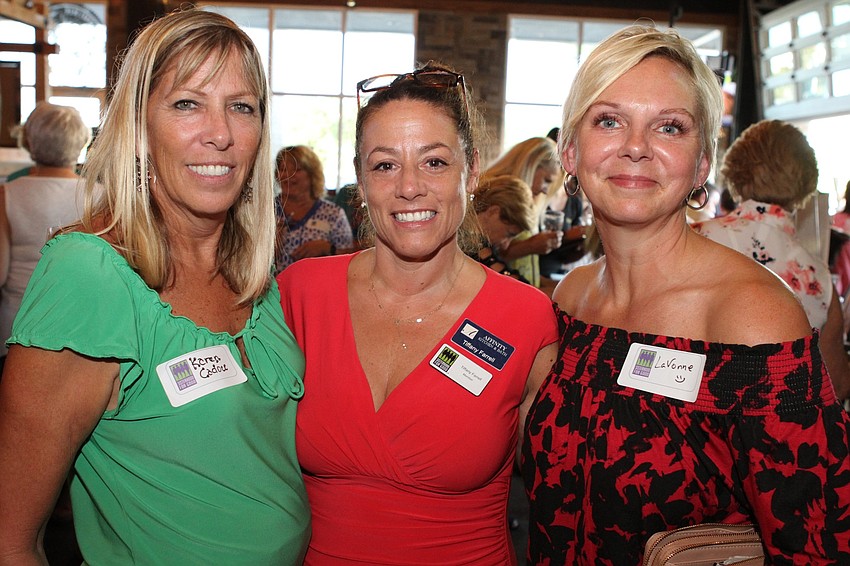 Karen Cadou, Tiffany Farrell and Lavanne Bower say that combined, they've brought some Christmas colors to the event.