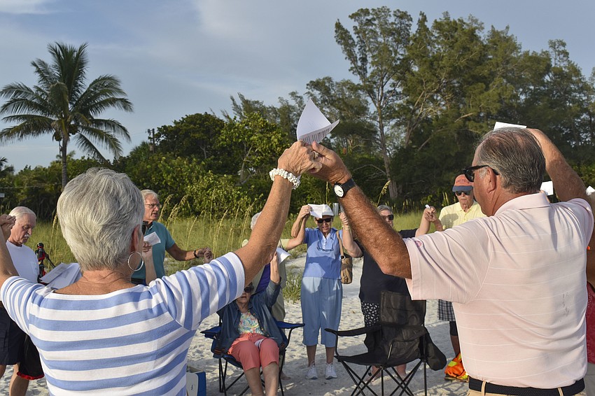The Christ Church congregation ends its service by joining hands in song.