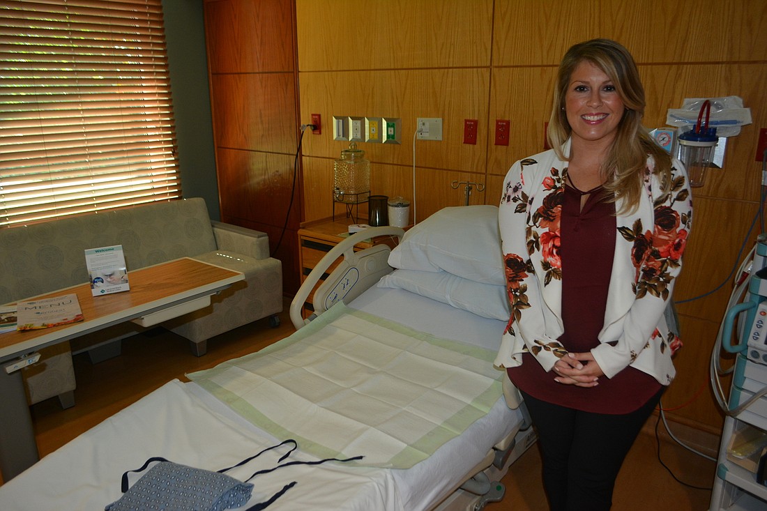 Chrissy Coney stands in one of Lakewood Ranch Medical Center&#39;s rooms for expectant moms.