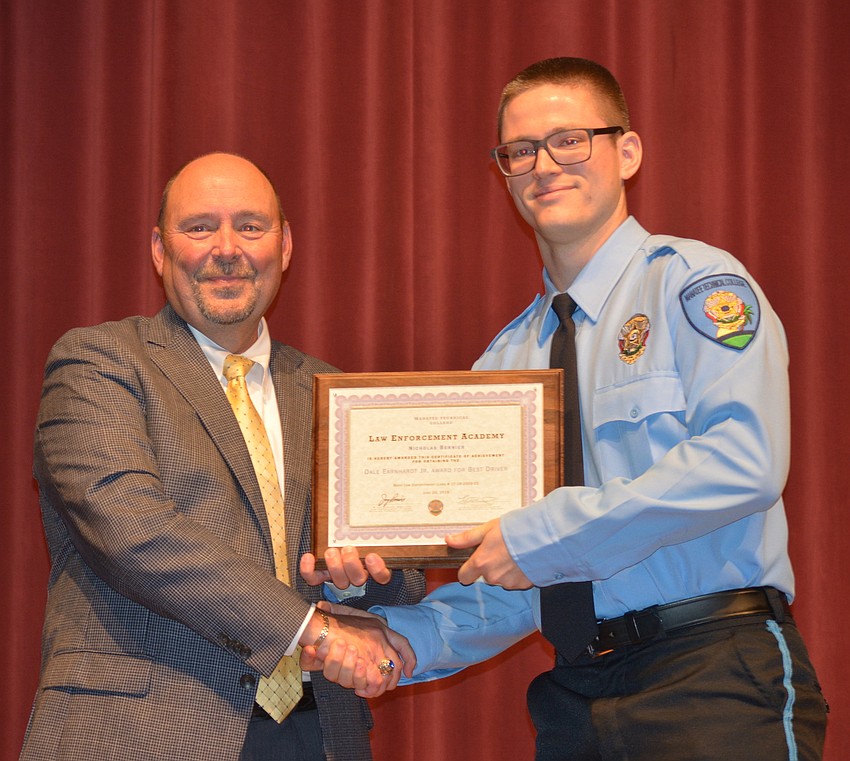 Nicholas Bernier receives his certificate for completing the Florida Law Enforcement Academy at Manatee Technical College.