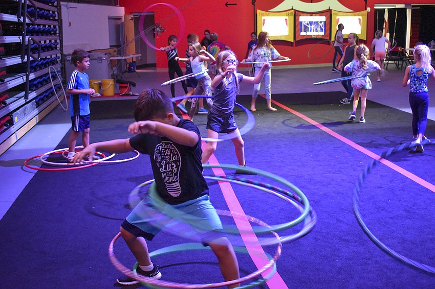 Steven Guardado hula-hoops during the camp-wide dance party.