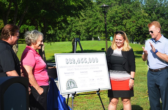 Mike Moran, Nancy Detert, Nicole Rissler and Charles Hines concluded the event with the official reveal of the bond
