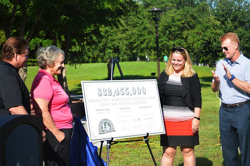 Mike Moran, Nancy Detert, Nicole Rissler and Charles Hines concluded the event with the official reveal of the bond
