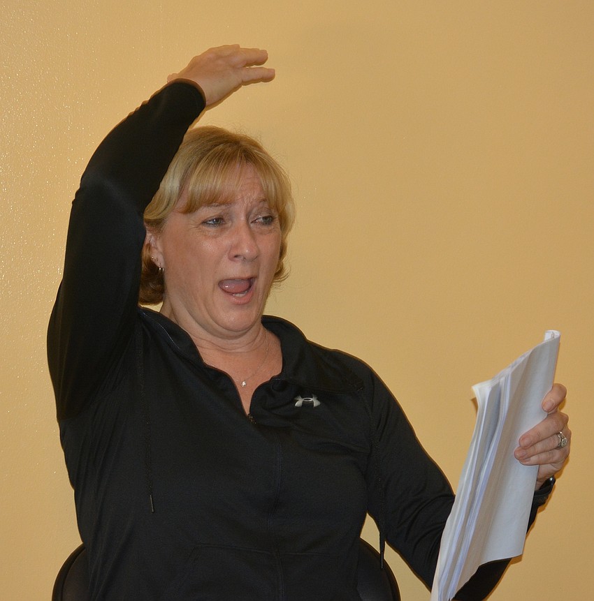 Michelle McCord, the co-owner with her husband, Matt, of Ovation School of Musical Theatre, leads the campers through a performance of 