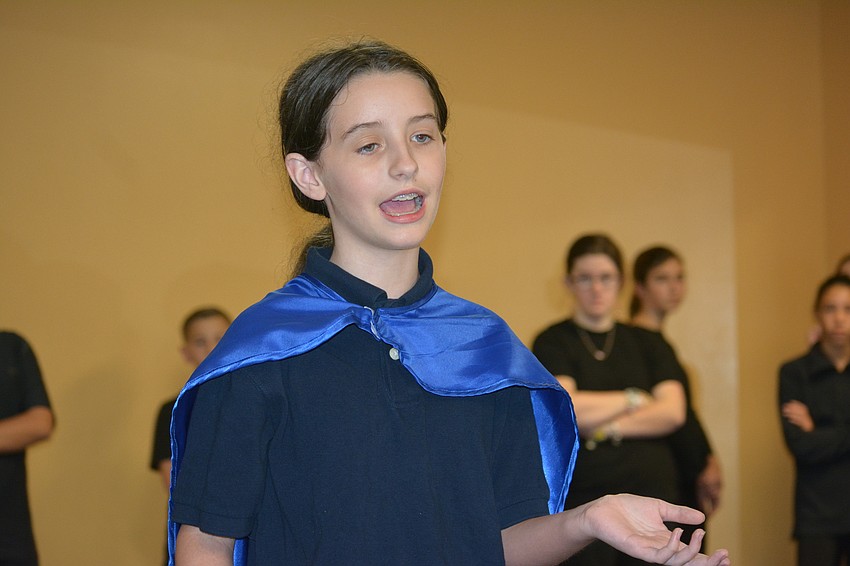 Mia DuJardin sings during a performance of 