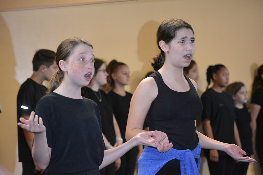 Alaina Cole and Carys Mathewson sing during the musical 