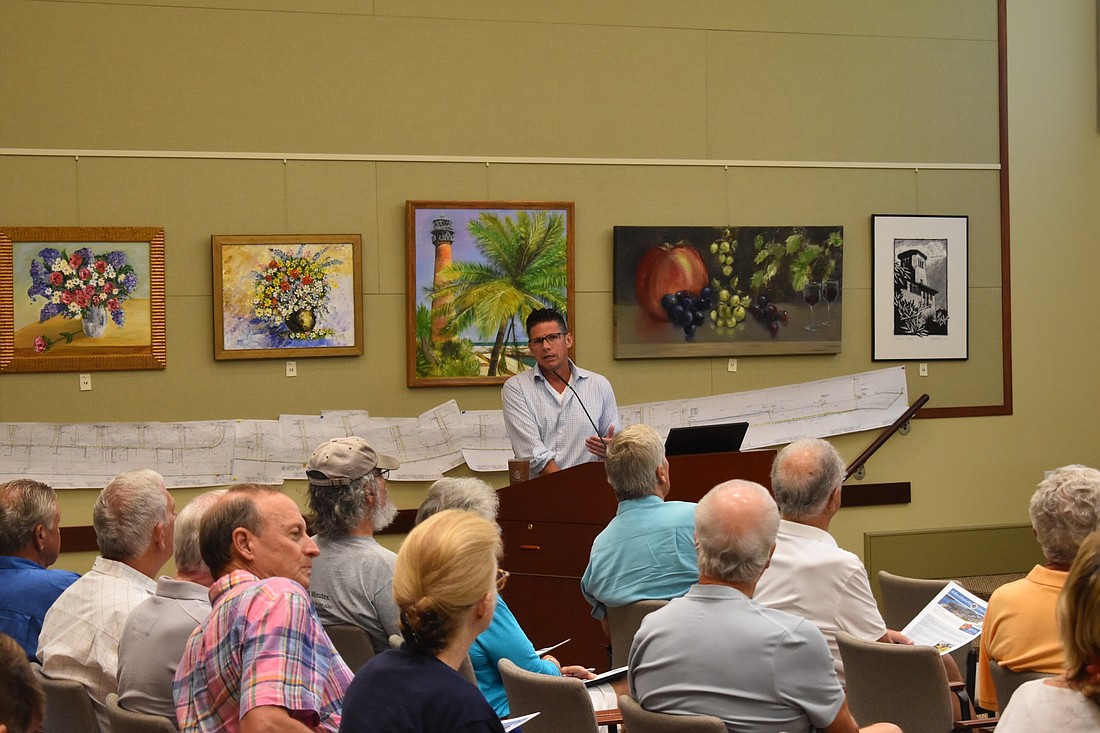 Town Consultant Mark Porter addresses Longboat Key residents on plans for underground utilities work Monday morning.