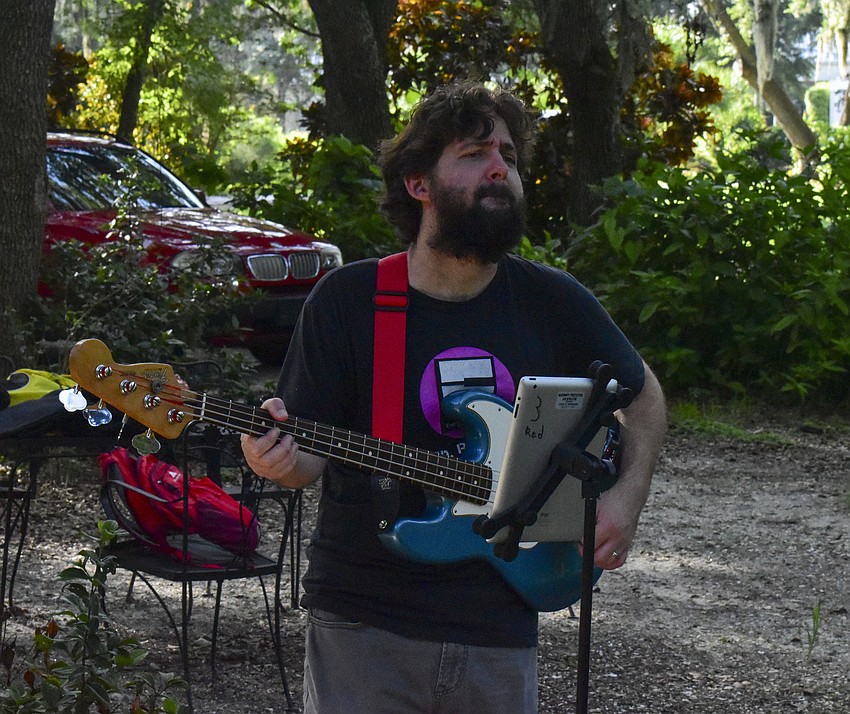 Gene Hodsdon plays bass from the sidelines.