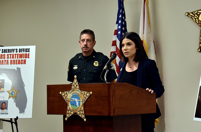 Col. Kurt Hoffman and Taylor Hatch, assistant secretary for the Florida Department of Children and Family's economic self-sufficiency program,  speak about the victims  who were affected by the operation.