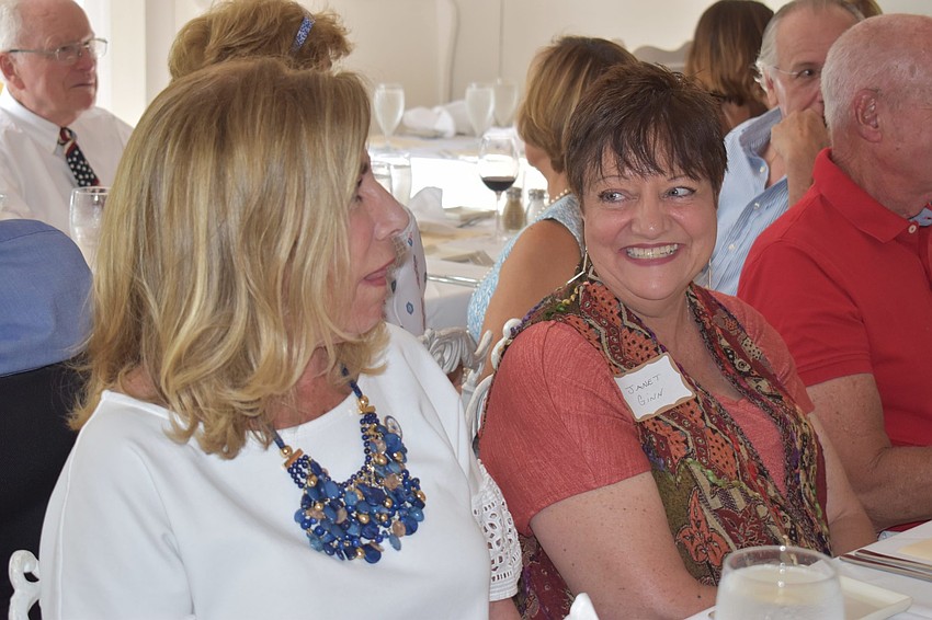 Nancy Rozance and Janet Ginn celebrate together.
