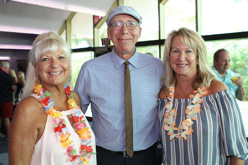 Suncoast Charities for Children Executive Director Lucy Nicandri, Tom Barwin and Julie Brown