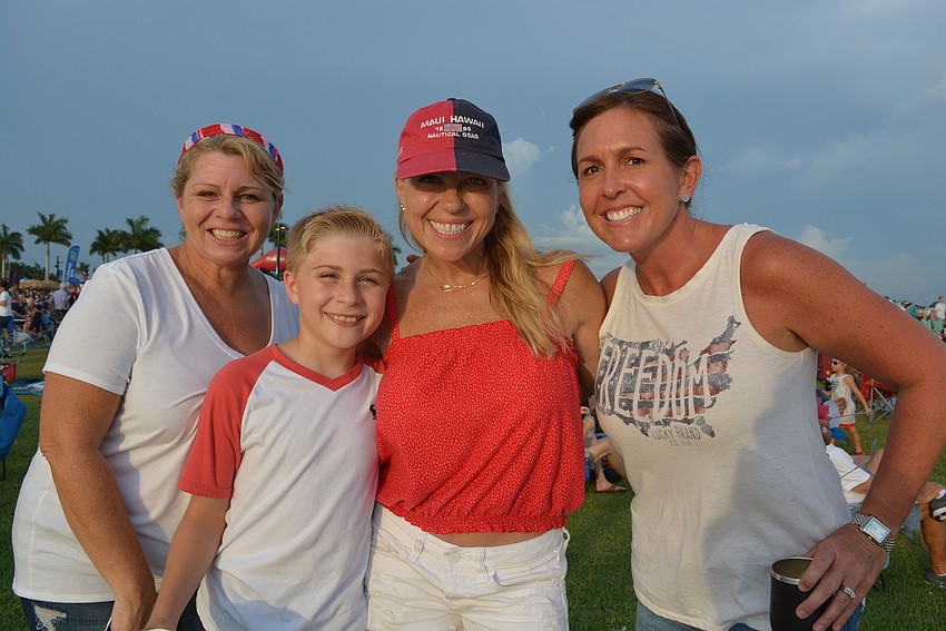 Lakewood Ranch's Keri Langlois, Bryce and Jenn Wilson and Michelle Smith watched their friend Kristen Labatsky complete the Fireworks 4-Miler On The Lake as they listened to music by the Greg Billings Band.