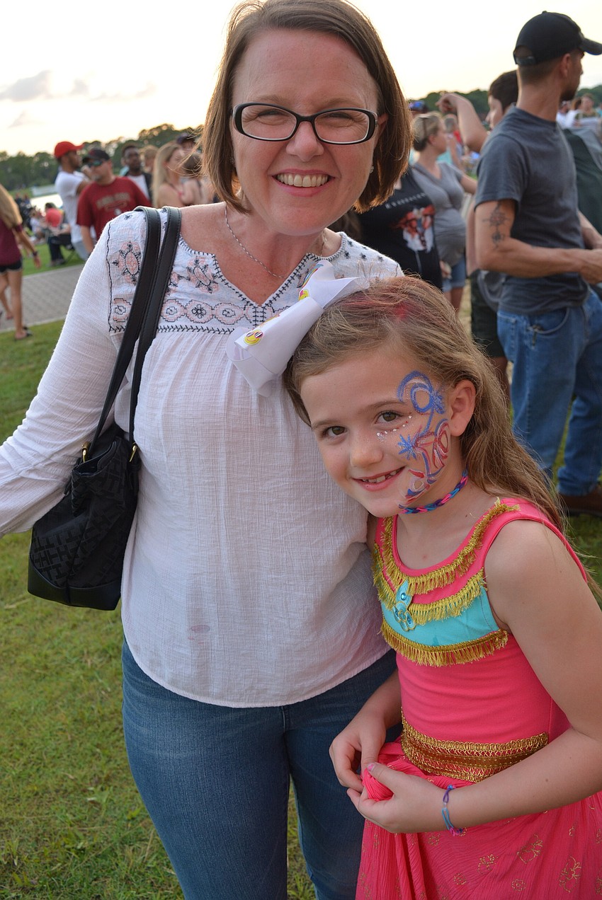 Lakewood Ranch's Cora Mounts, pictured with her mom, Tashka, left, liked the children's activities, music, food and especially Kona Ice.