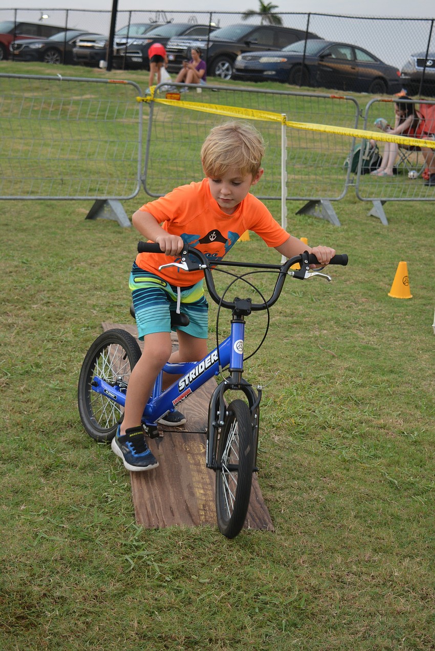 Sarasota 6-year-old Nathan Kernan tests his balance and agility at Sarasota BMX's Strider Adventure Zone.