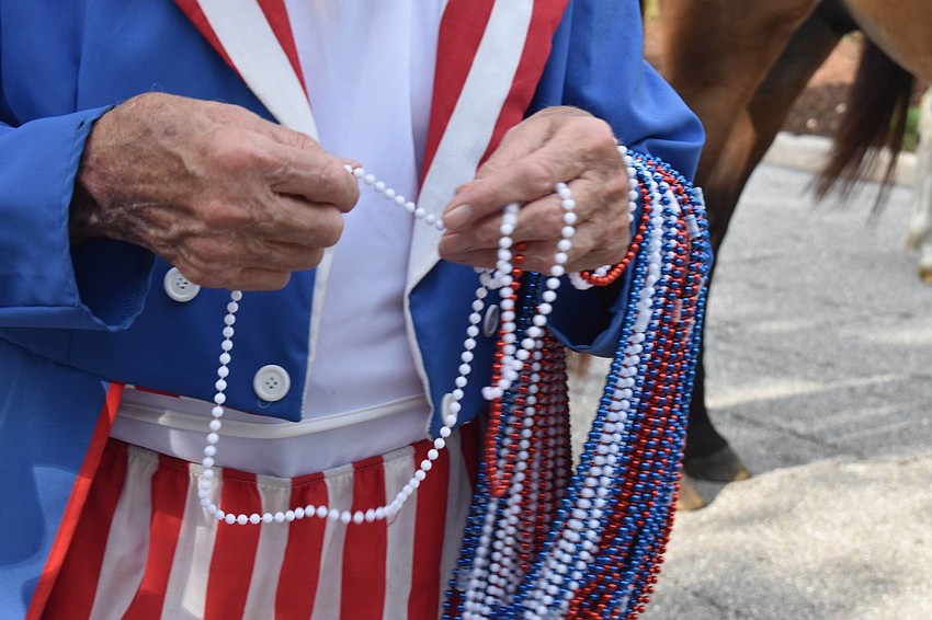 Uncle Sam, AKA Jim Seaton, passed out beads along the short parade route.
