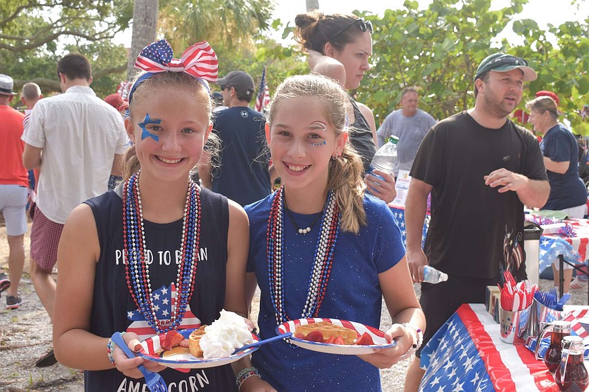 Briley Fleeman and Macee Haygood snagged their patriotic Blue Dolphin Cafe waffles.