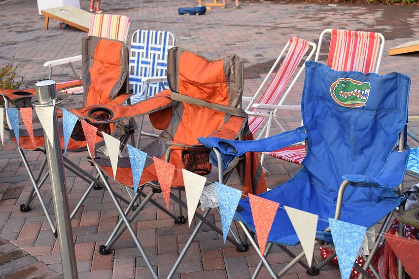 Chairs hold fireworks spots while the families revel in the activities at Selby.