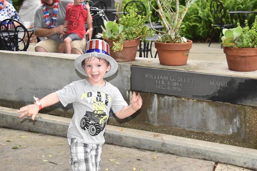 Wade Abercrombie dances to the music at Marie Selby Botanical Gardens.