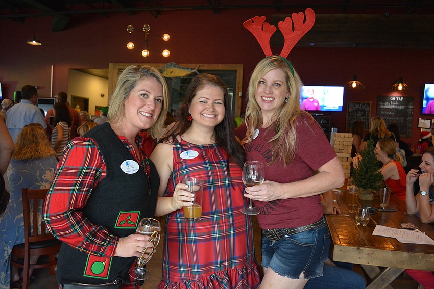 Cheers for Charity members Stephanie Kotlarczyk, Erika Chapman and Erin Crowell  had never been to a Christmas in July party, but loved the festive spirit.