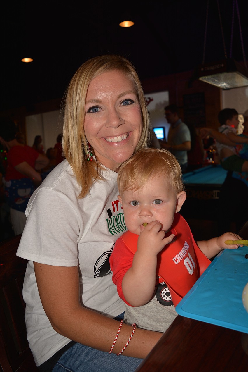 Cheers for Charity member enjoys the night with her 1-year-old, Parker. 