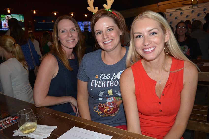 Sarasota's Deanna Austin, Jill Gass and Ashley Dooley enjoy doughnuts, chicken egg rolls and pork dumplings from Dibs Food Truck.