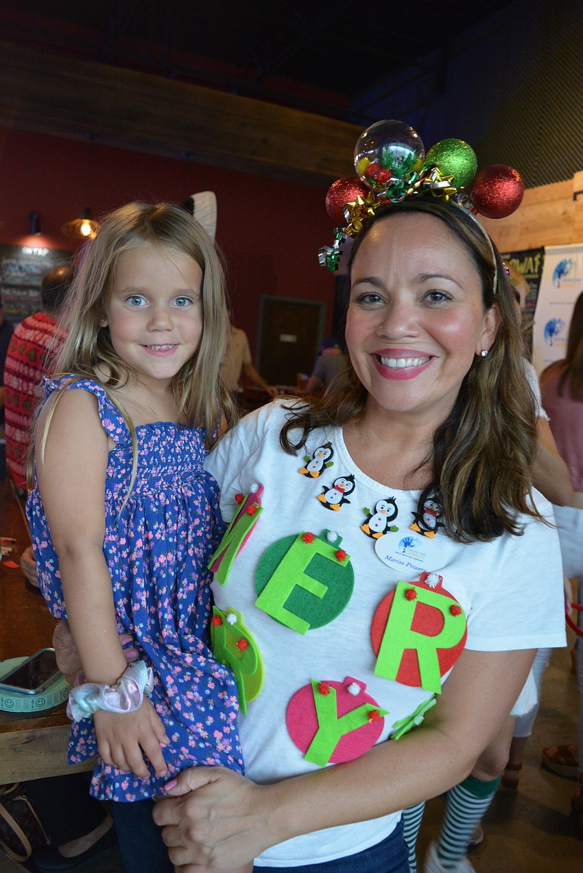 Amelia and Marissa Powers, of Bradenton, enjoy spending some time together. Amelia likes her mom's special headband.