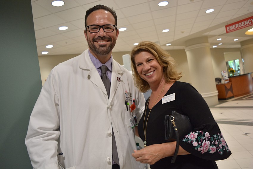 Dr. Miguel Pelayo and physician liaison Mary Ellen Woska, both of Florida Cancer Specialists, say there is a demand for the robot-assisted surgery.