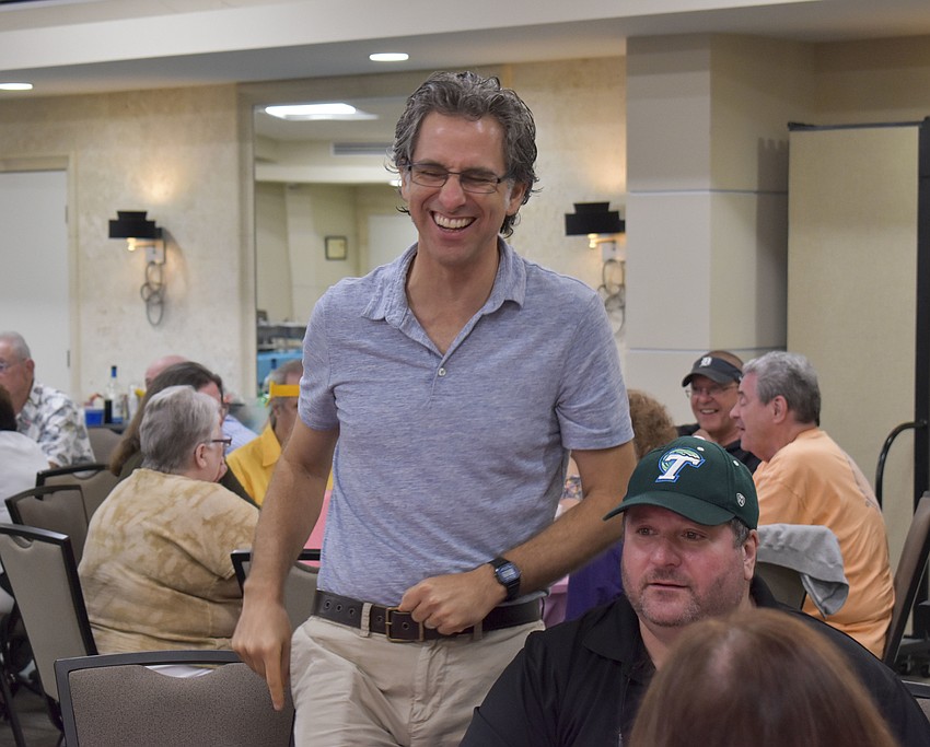 Rabbi Brenner Glickman celebrates after his team answered a question right.