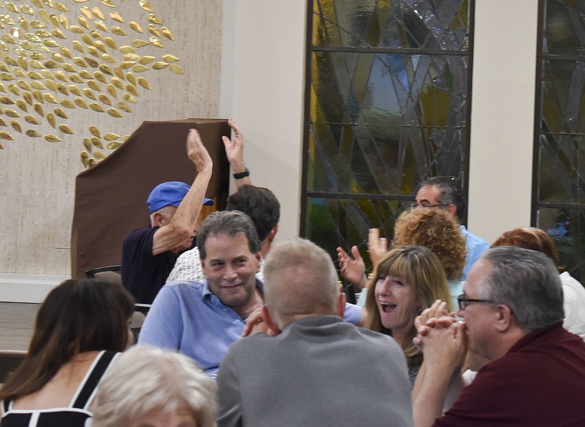 Teams celebrate as they hear their answers were right.