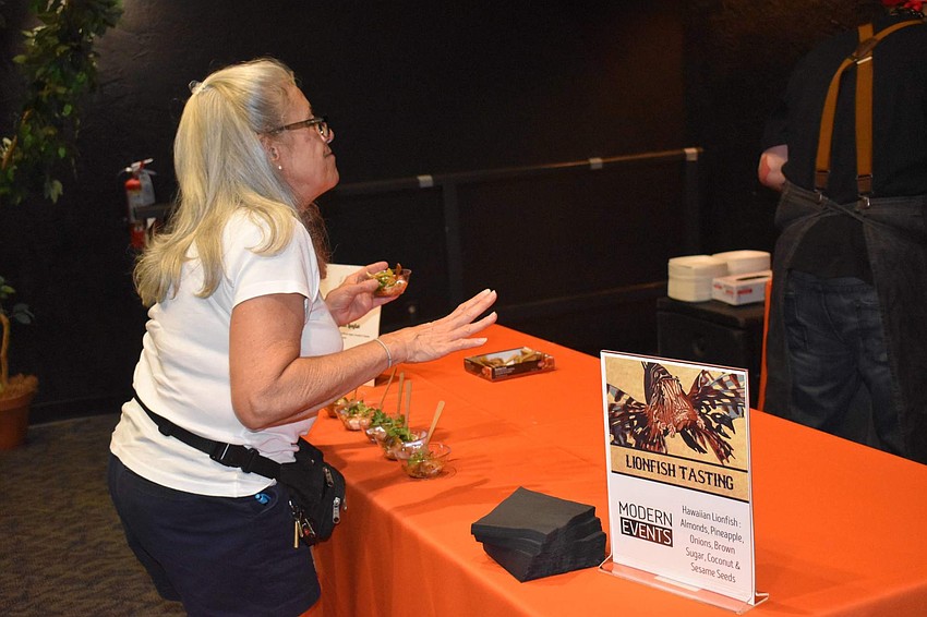 Linda Gerlach compliments the chefs of Modern Events on their Hawaiian Lionfish.