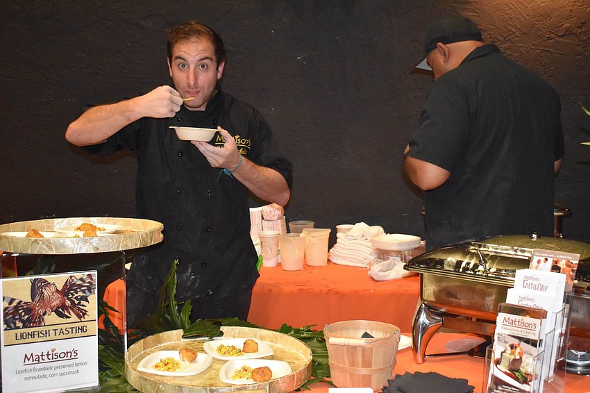 Nick Bryan of Mattison's tastes another lionfish dish.