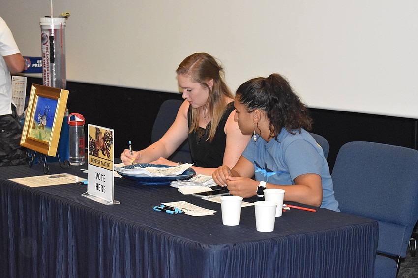 Jessica Stich and Juliette Camara tally the votes.