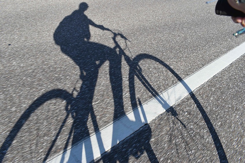 Behind the camera. Nat Kaemmerer balances biking and shooting.