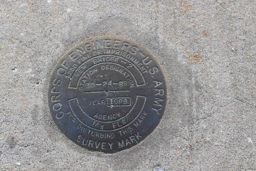 Markers like this one on the bridge that divides Sarasota and Longboat Key aren't rare, but would you notice them by car? Certainly not.