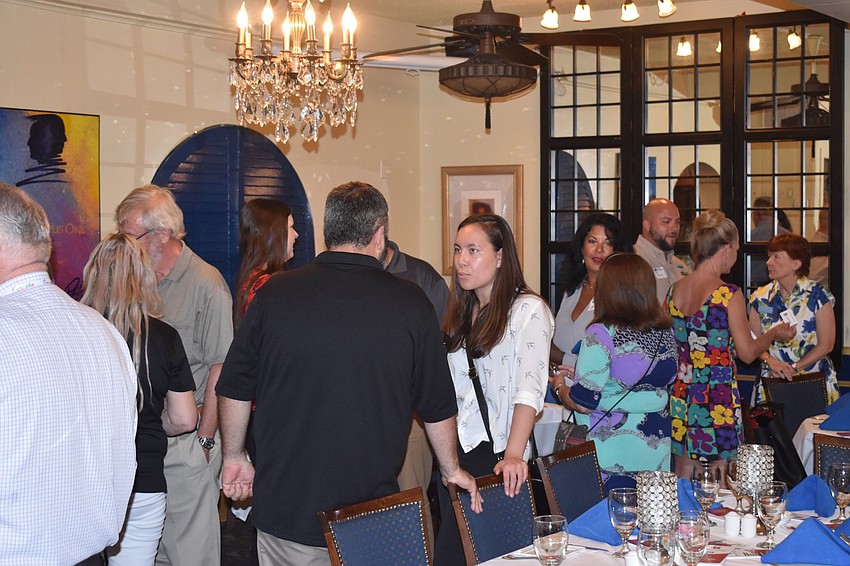 Folks mingled and networked before the luncheon.