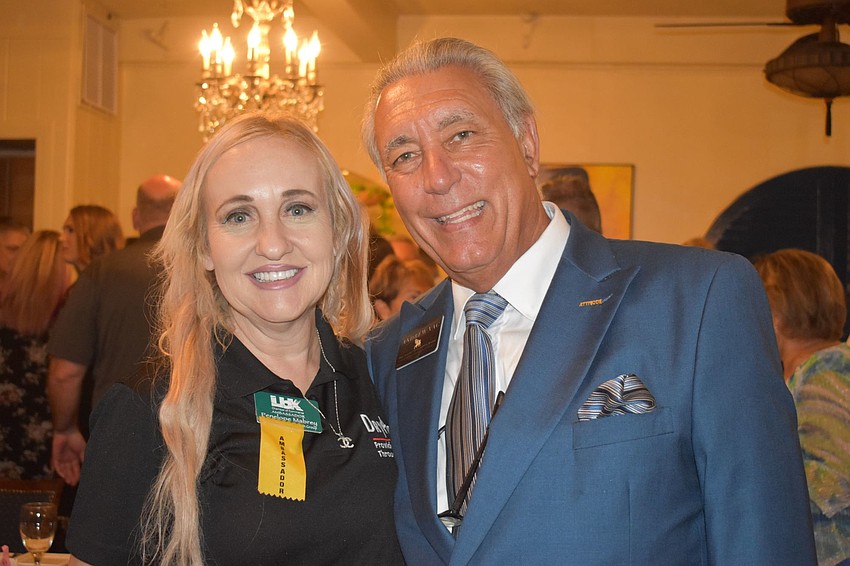 Penelope Mabrey and Andrew Vac, Chamber members, posed for photos.