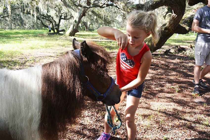 Parrish's Kamryn Gillen asks her horse, Perfection,  if she's a good horse. Perfection nods for a treat.