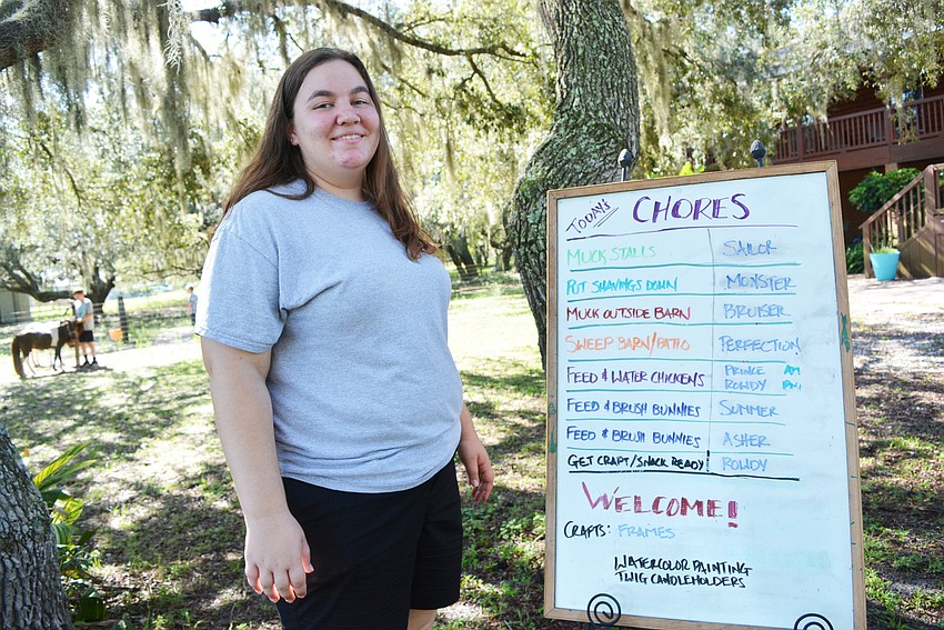 Camp counselor Carly Lynch, an upcoming senior at Lakewood Ranch High School, sets the  campers chores each day.