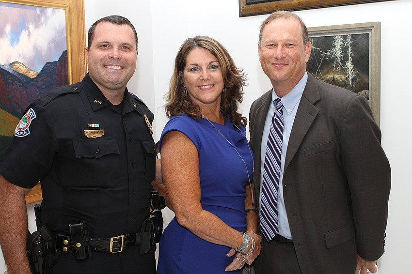 Deputy Chief Pat Robinson, Tess Luli and Assistant State Attorney Craig Schaeffer