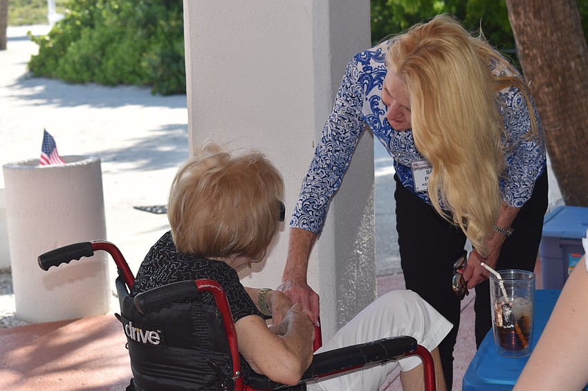 Jean White and Susan Phillips greet each other at the event.