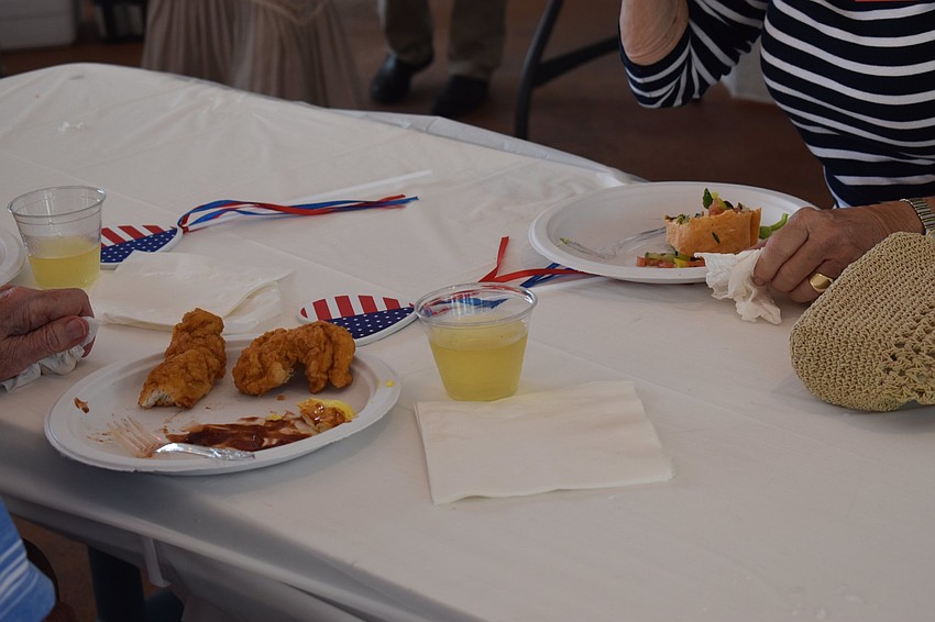 Attendees ate with American-themed items nearby.