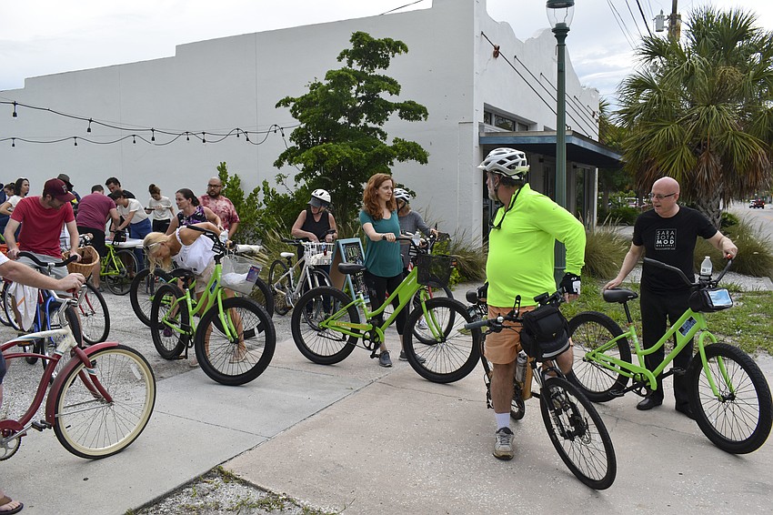 The cyclists get ready to take off on the tour.