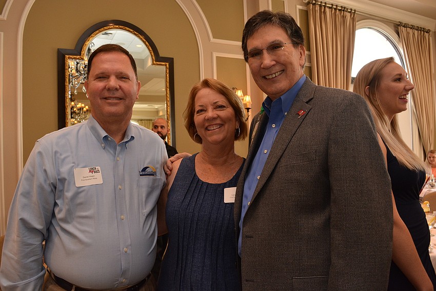 Dan and Tammy Hager, of First Southern Bank, catch up with Manatee Healthcare System Vice President Vernon DeSear.