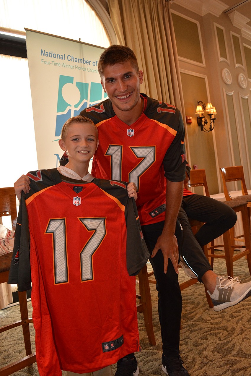 Sarasota 9-year-old Grant Yeagley wins a jersey autographed by wide receiver Justin Watson.