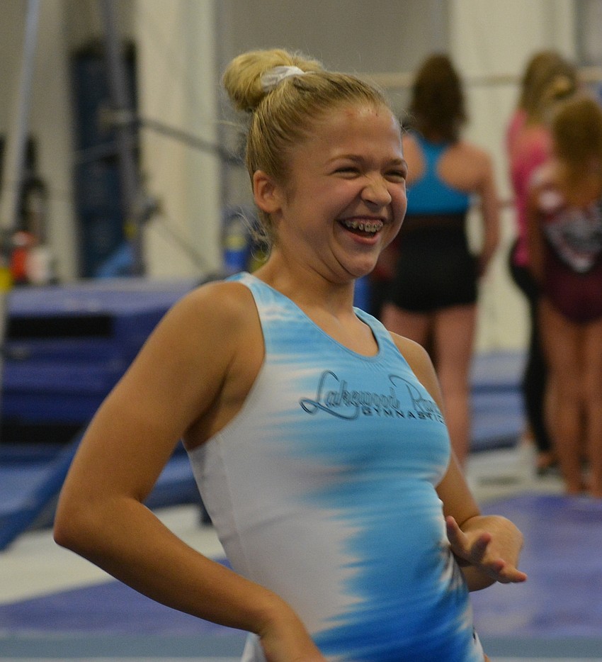 Lakewood Ranch Gymnastics' EmmaGrace Kelly performs a body movement drill.