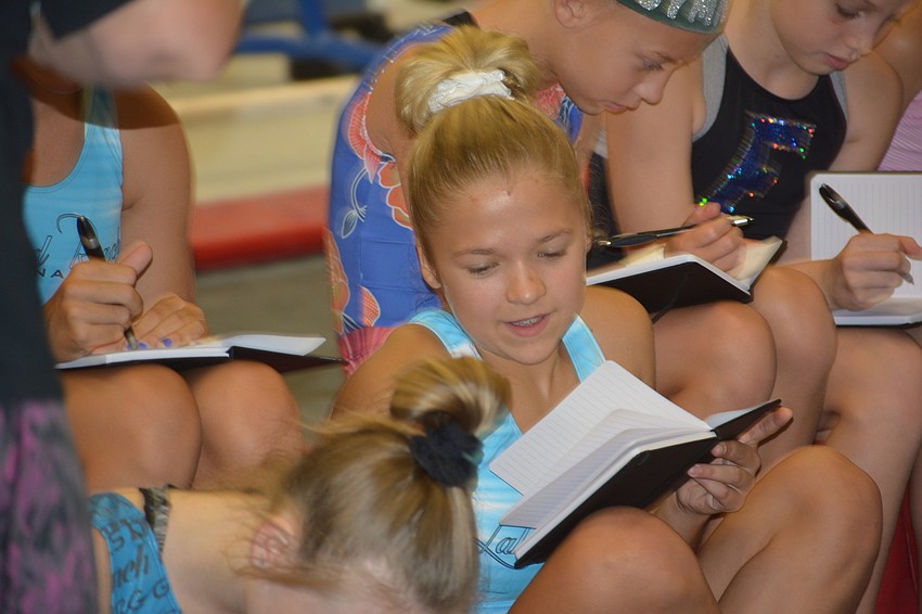 EmmaGrace Kelly keeps notes because learning isn't all physical exercise.