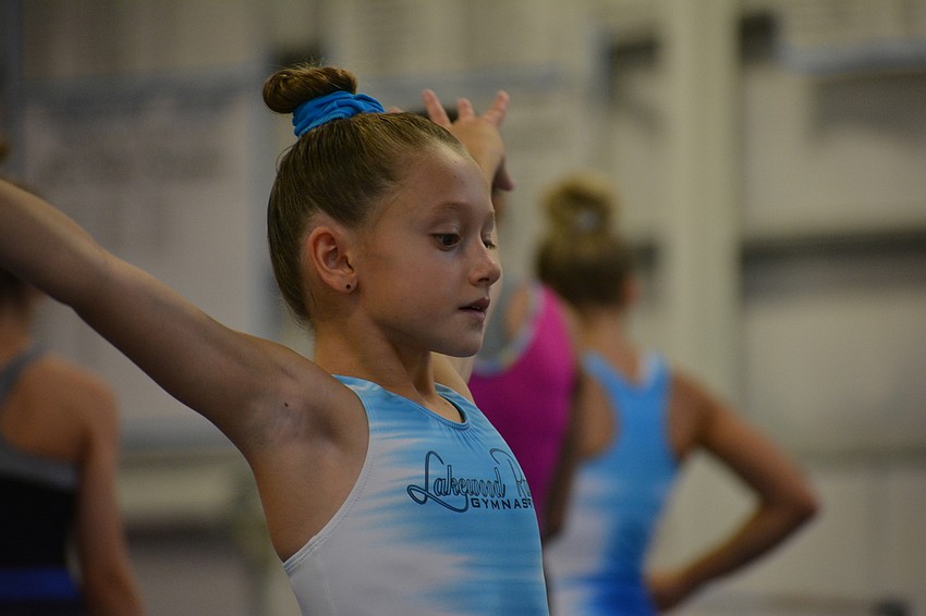 Camilla Mohammadbhoy practices a bold movement to finish a routine.