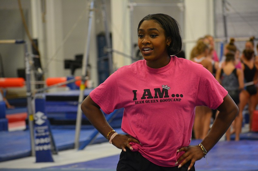 Hallie Mossett is a former UCLA gymnast who leads a group of the gymnasts.