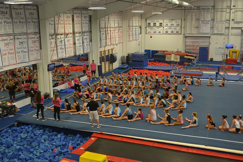 The gymnasts are welcomed before Saturday morning's session.