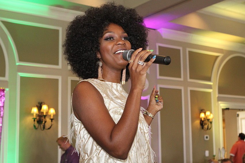 Ericka Dunlap sang near the end of the event.